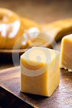 dulce de lethe or homemade caramel, cut into cubes, on a wooden table