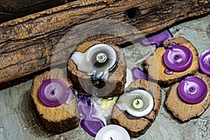 Dull candles with ornate wood and scented and energetic incense photo