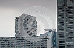 Dull cityscape of gray high-rise tower blocks and gray sky