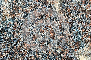 Dull red granite rock polished surface