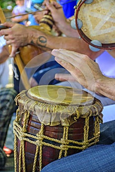 Dum player and other instrumentalists during a samba performance photo