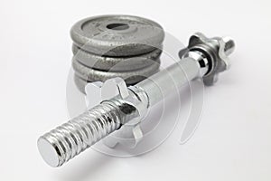 Dumbbell bar and Weight plates on white background