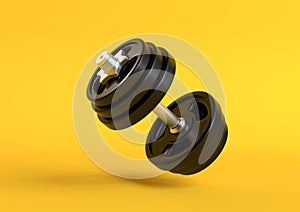 Dumbbell with black plates levitating in air on bright yellow background