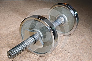 Dumbbell on carpet.