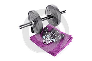Dumbbell, hand grips and a towel
