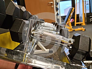 dumbbell rack with different weights in the gym
