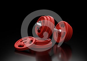 Dumbbell with red plates isolated on black background