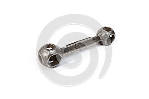 dumbbell spanner or dogbone wrench for hexagonal head cap  Bike screws, soft focus close up photo