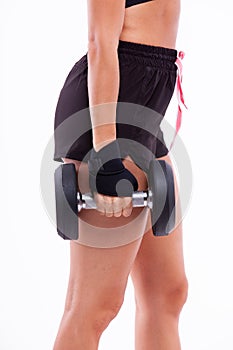 Dumbbell in a woman's hand close up