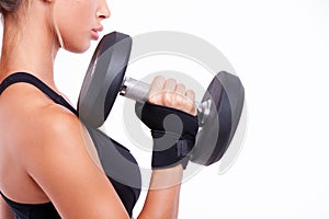 Dumbbell in a woman's hand close up