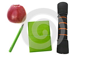 Dumbbelll and notebook isolated white