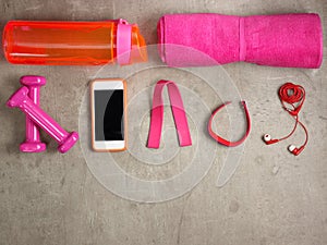 Dumbbells, bottle of water, tracker, elastic band, smartphone
