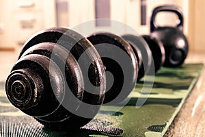 Dumbbells and kettlebells are sports equipment for home sports. Lifestyle concept of health.