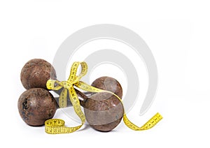 Dumbbells and measuring tape. Old rusty dumbbells on white background. Copy space