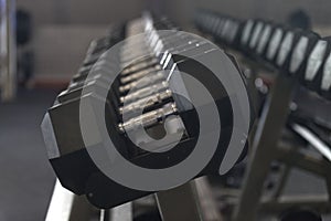 Dumbbells on a weight rack