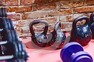 dumbbells and weights on shelves