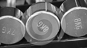 Dumbells on the row black and white