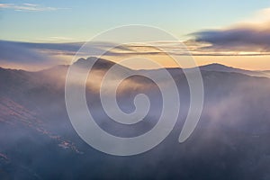 Dumbier peak under mist during autumn sunrise, view from Skalka mountain