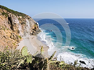 Dume Cove Malibu Beach, August 14, 2017: view from Dume Point overlook at Zuma Beach, emerald and blue water in a quite paradise b