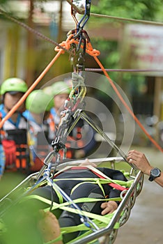 A dummy being restrained in a basket stretcher