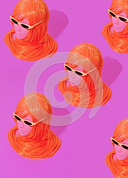 Dummy fashion girl with pink long wig hairs. Party shop, halloween, holiday concept.  Minimalist isometric wallpaper. 90s style