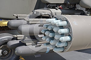 Dummy inert missiles and bombs mounted on the side rocket launchers of a combat helicopter photo