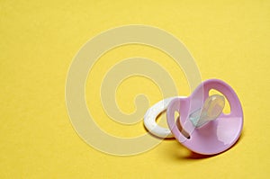 Dummy Pacifier on Yellow Background