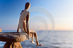 Dummy sitting on the stone