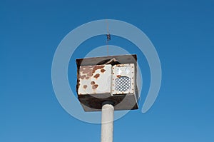 Dummy traffic camera fixing speed on a background of blue sky