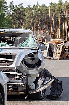 Dump of shot and burned civilian cars by Russian invaders in Ukraine. The remains of cars that were shot and destroyed by shell