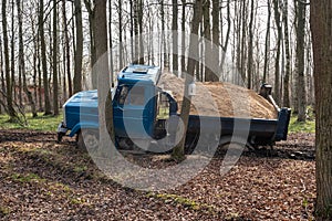 Dump truck car stuck in mud on road. Blurry mud bad road in the park. ÃÂ¢ruck dump car with sand stopped due to wet dirty on