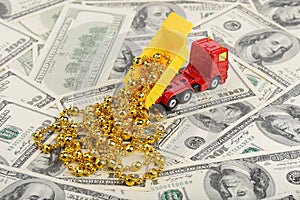 Dump truck and christmas toys on the dollars background