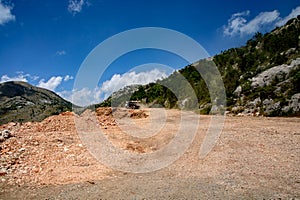 Dump truck on the construction of a mountain road