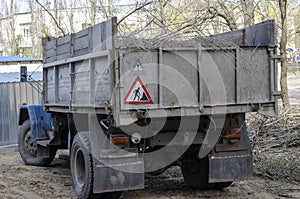 Dump truck with cut tree branches