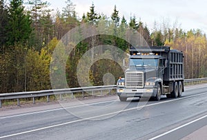 Dump truck on road of