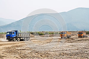 Dump truck on a road, on a sunny summer day.