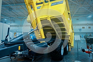 Dump Truck. Self-unloading cargo vehicle, with a body mechanically tilted for unloading cargo photo
