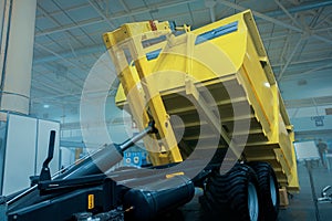 Dump Truck. Self-unloading cargo vehicle, with a body mechanically tilted for unloading cargo photo