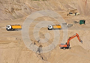 Dump truck transports sand in open pit mine. In the production of concrete, concrete for the construction using coarse sand.