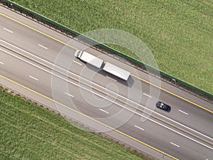 Dump trucks carrying goods on the highway.