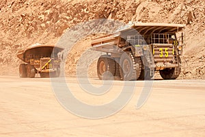 Dump trucks at an open-pit copper mine