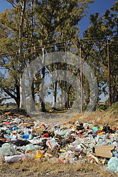 Dump with various type of trash, most of all plastic household rubbish in a meadow near Bloemfontein in South Africa