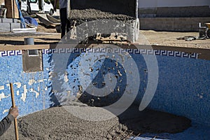 Dumper unloading the concrete into the pool