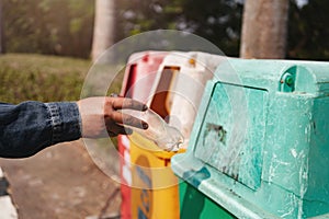 .Dumping garbage bottles into the bin