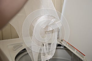 Dumping Laundry in a Washing Machine