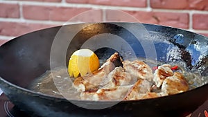 Dumplings baking on a cast-iron frying pan