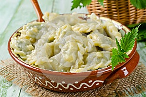 Dumplings with cheese and nettles in a bowl