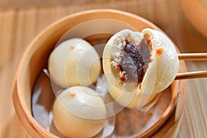 Dumplings of dense Dousha on bamboo tray in restaurant