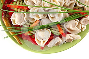 Dumplings with peppers on green