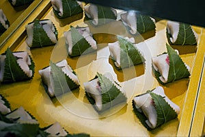 Dumplings possibly sweet with a green leaf in Tpkyo